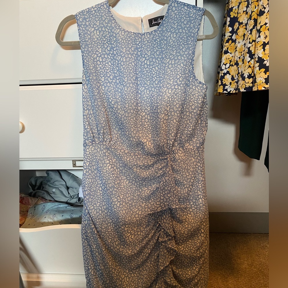 Beautiful, light dress with ruffle details along the bottom side.